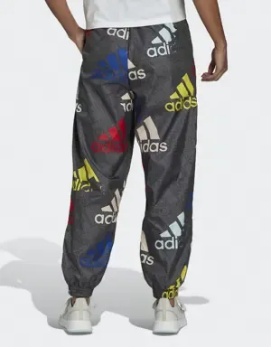 ADIDAS PANTALóN ESSENTIALS MULTICOLORED LOGO LOOSE FIT WOVEN