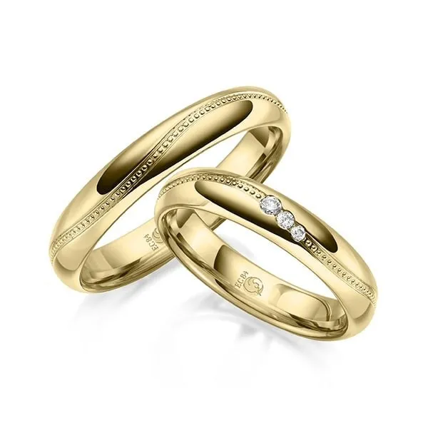 Alianzas de boda en oro diseño especial con 3 diamantes