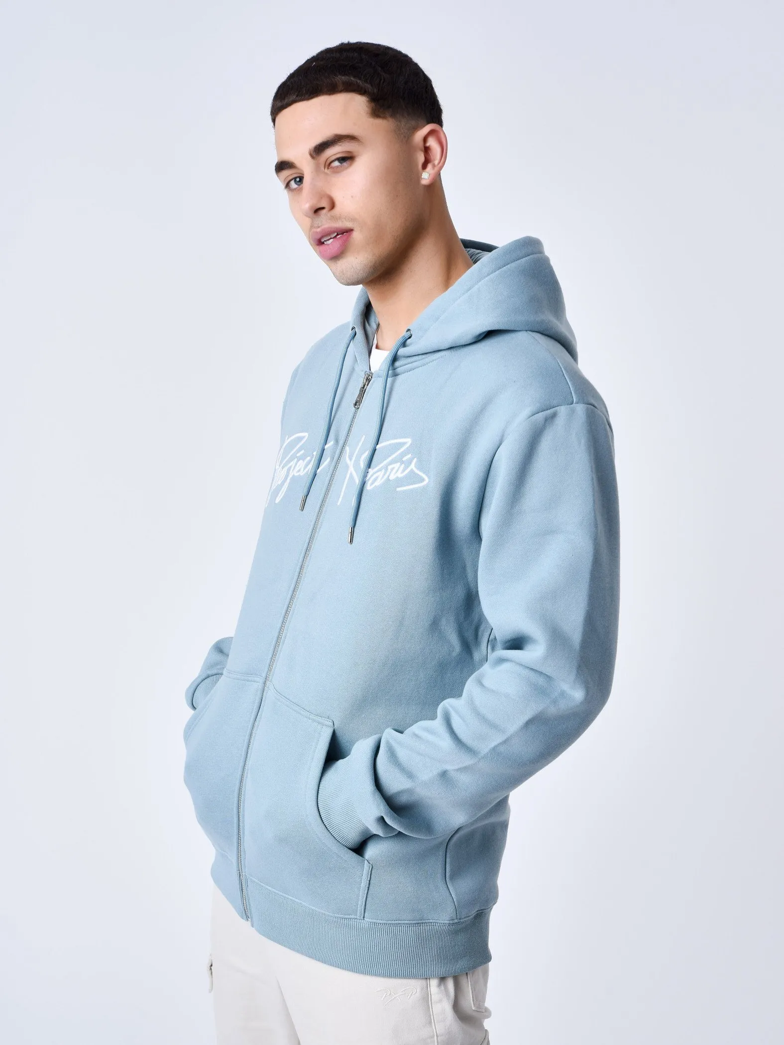 Chaqueta con cremallera y capucha Origin con bordado