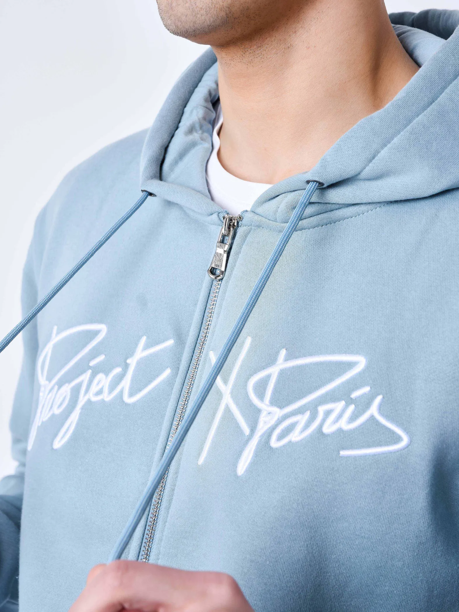 Chaqueta con cremallera y capucha Origin con bordado