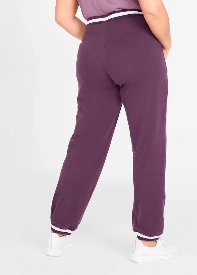 Pantalón deportivo con bolsillos con cierre morado intenso