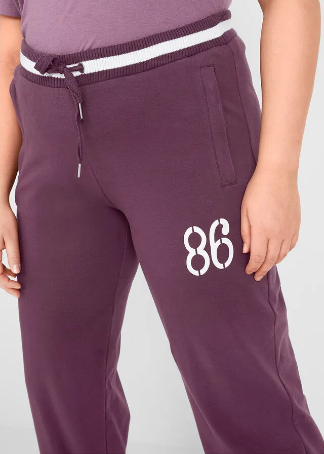 Pantalón deportivo con bolsillos con cierre morado intenso