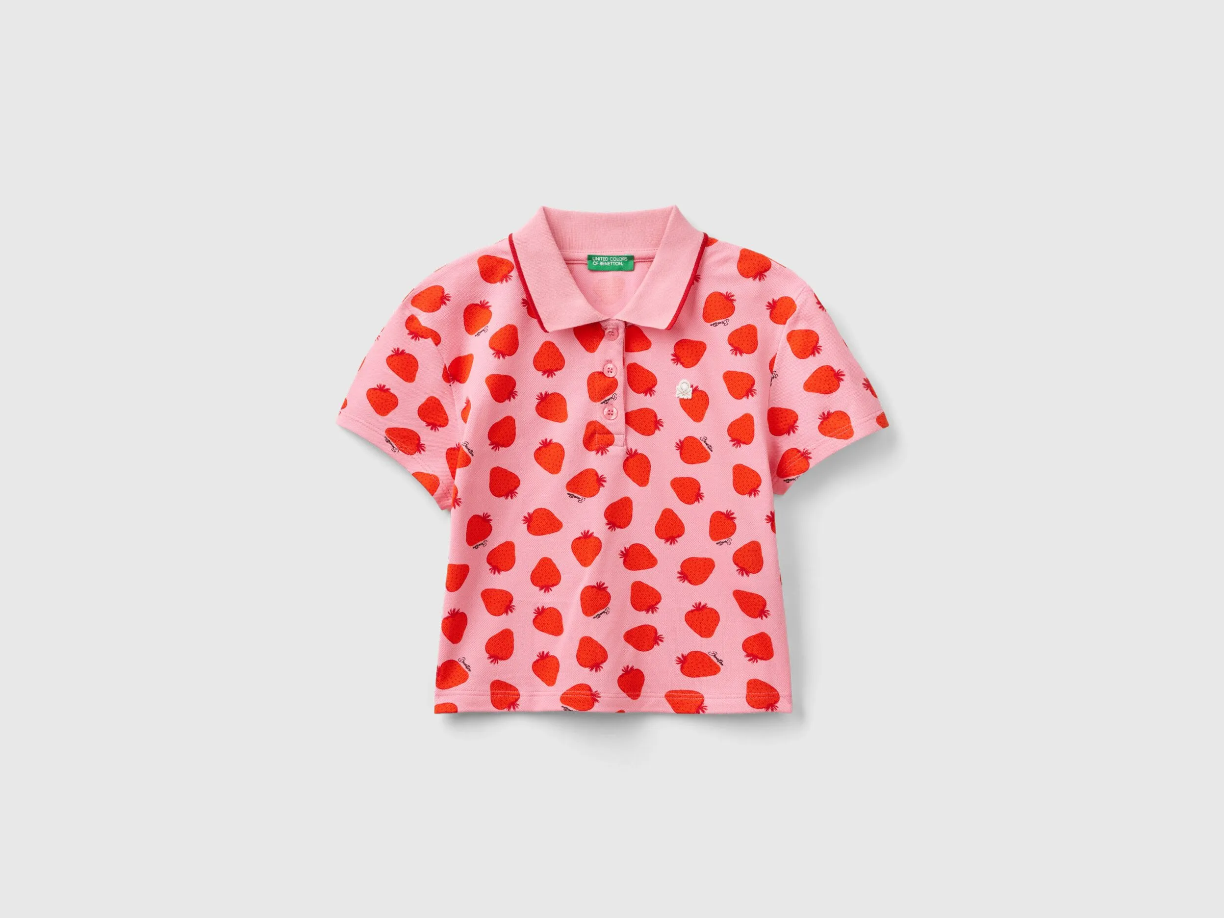 Polo rosa con estampado de fresas