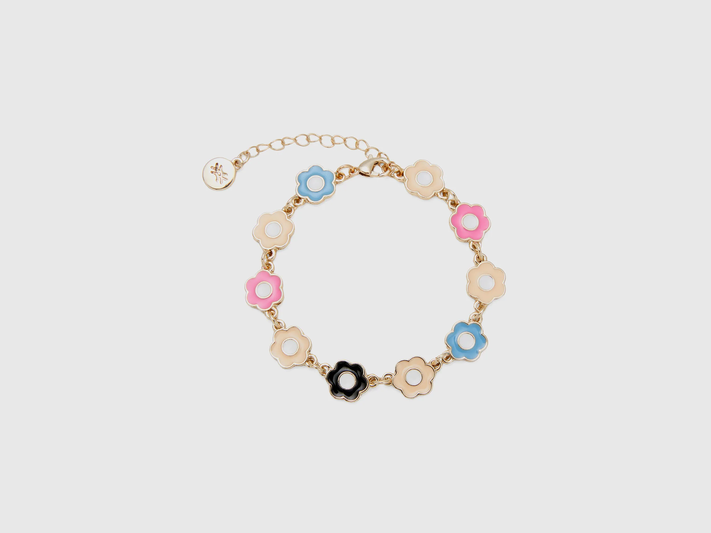 Pulsera dorada con colgantes florales