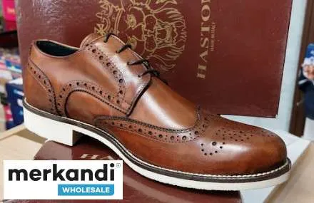 Stock de zapatos deportivos para hombre surtido de colores y modelos (CAT, FLY FLOT, PACKARD, STONE HAVEN, UGO TURATI)