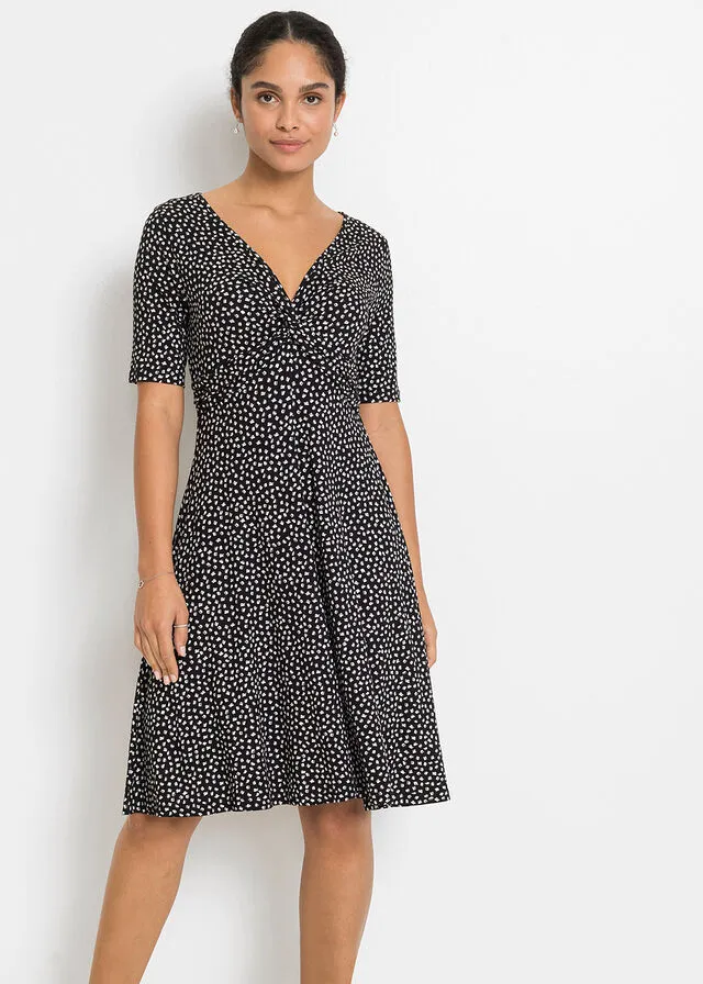 VESTIDO DE PUNTO ESTAMPADO CON DRAPEADO NEGROBLANCO CON ESTAMPADO GRáFICO