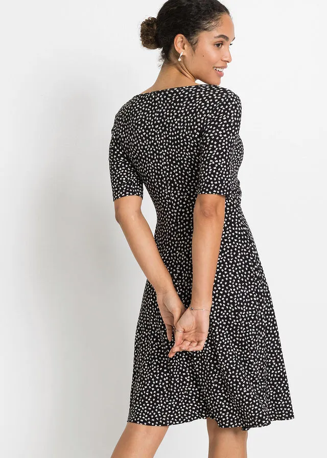 VESTIDO DE PUNTO ESTAMPADO CON DRAPEADO NEGROBLANCO CON ESTAMPADO GRáFICO