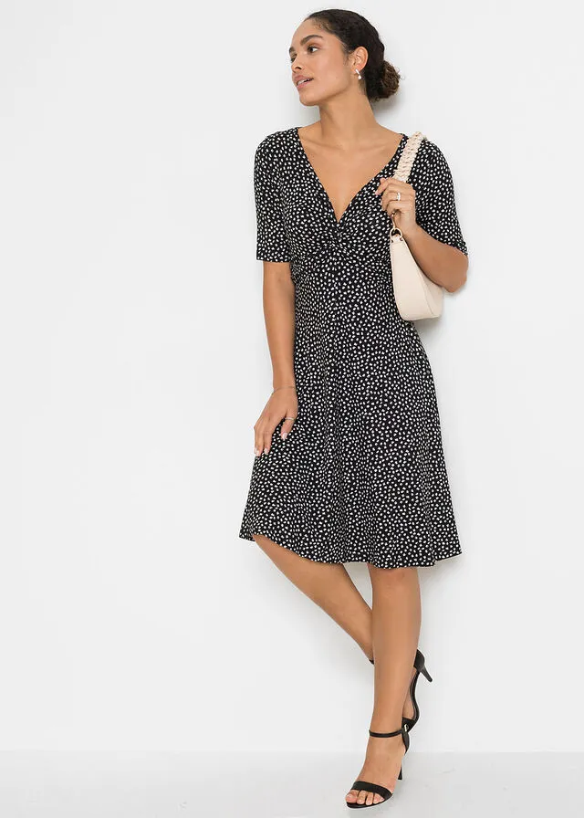 VESTIDO DE PUNTO ESTAMPADO CON DRAPEADO NEGROBLANCO CON ESTAMPADO GRáFICO