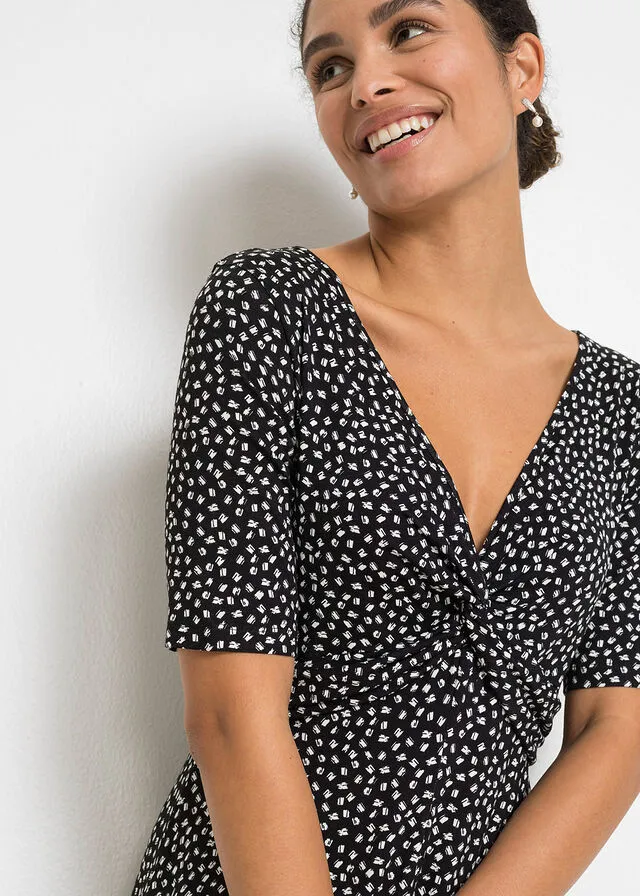 VESTIDO DE PUNTO ESTAMPADO CON DRAPEADO NEGROBLANCO CON ESTAMPADO GRáFICO